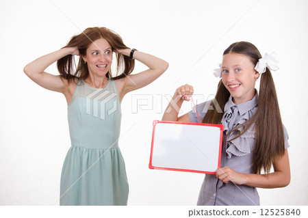 Trainee with a sign mocks pupil 12525840