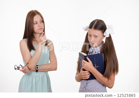 The teacher shakes his finger at the student 12525865