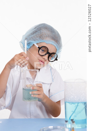 Girl chemist prevents the liquid in flask Girl chemist prevents the liquid in flask 12526027