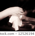 Giving a paper handkerchief to a friend 12526194