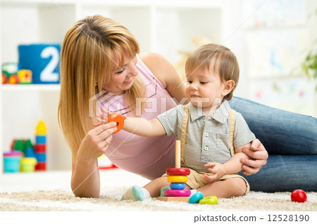 cute mother and child boy play together indoor at home 12528190