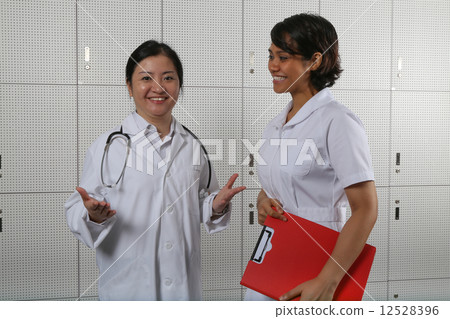 Welcoming lady doctor and nurse team. 12528396