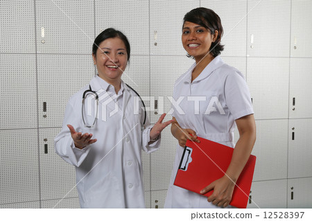 Welcoming lady doctor and nurse team. 12528397
