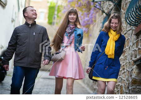 Friends in Paris walking together Friends in Paris walking together 12528605