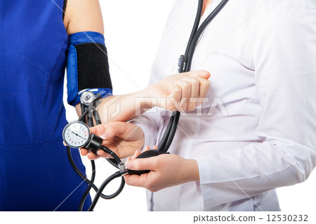 Doctor Checking Blood Pressure Of A Patient 12530232