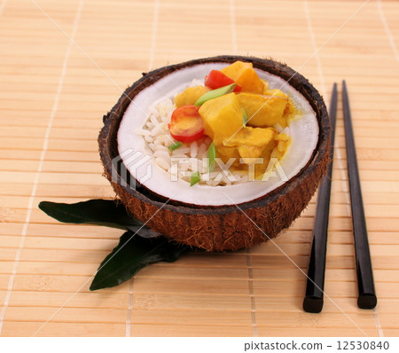 oconut with rice and curry chicken on bamboo background 12530840
