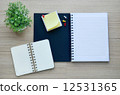 Blank notebook on the wood table - Top view 12531365