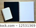 Two blank notebook on the wood table - Top view 12531369