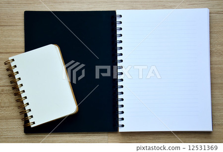 Two blank notebook on the wood table - Top view 12531369