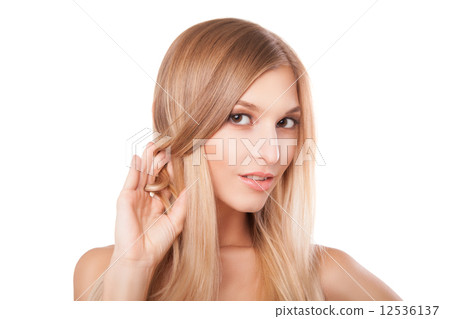 Woman with long straight blond hairs isolated 12536137