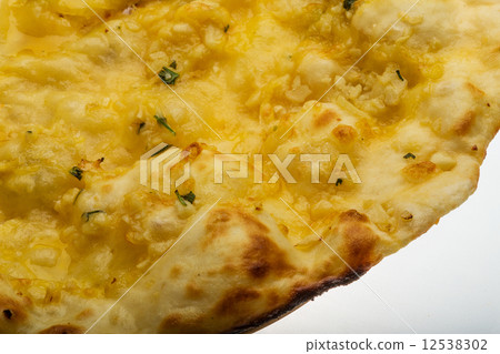 Naan with cheese and garlic Naan with cheese and garlic 12538302