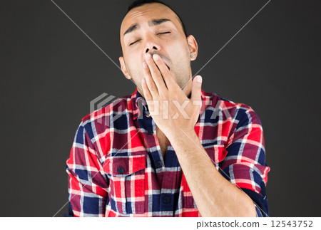 model isolated on plain background tired bored yawning model isolated on plain background tired bored yawning 12543752