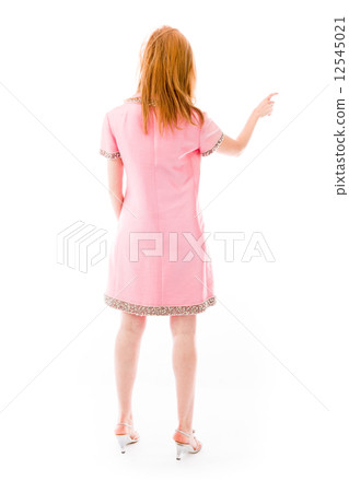 model isolated on plain background back pointing 12545021