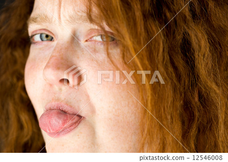 model isolated on plain background face sticking tongue out model isolated on plain background face sticking tongue out 12546008