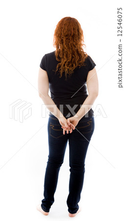 model isolated on plain background back hands on hips model isolated on plain background back hands on hips 12546075