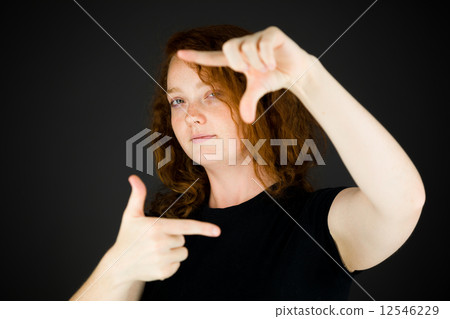 model isolated on plain background hand gesture framing focusing 12546229