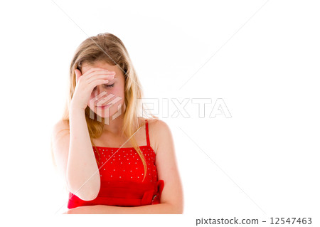model isolated on plain background ashamed hiding face in hand model isolated on plain background ashamed hiding face in hand 12547463