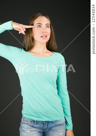 model isolated on plain background hand gesture gun 12548834
