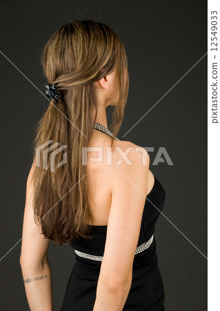 model isolated on plain background back looking behind 12549033