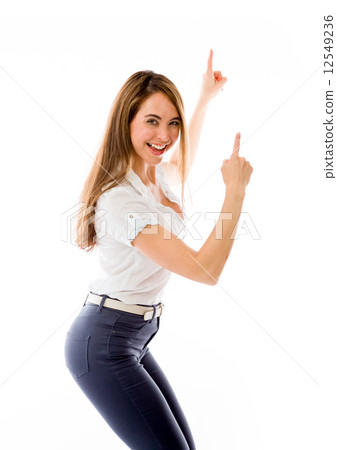 model isolated on plain background looking at camera pointing 12549236