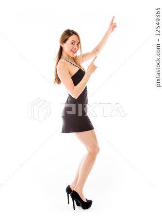 model isolated on plain background looking at camera pointing 12549365