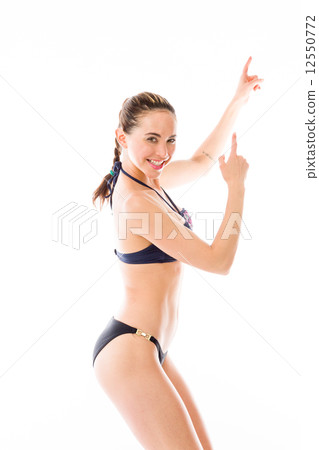 model isolated on plain background looking at camera pointing model isolated on plain background looking at camera pointing 12550772