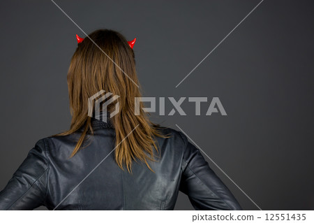 model isolated on plain background back hands on hips 12551435