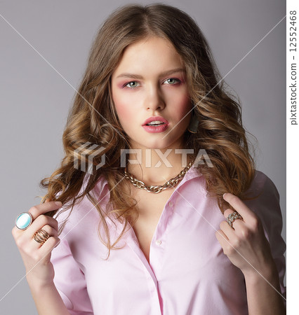 Beauteous Auburn Female in Light Blouse Holding Her Hairs 12552468