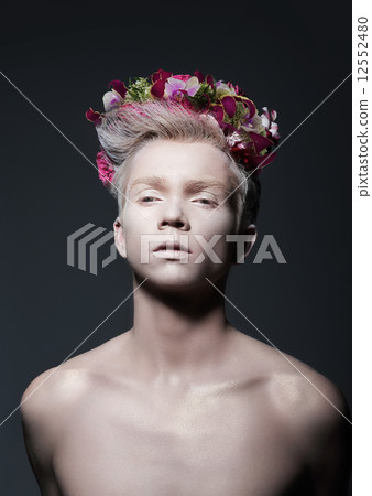 Beauty. Young Man with Wreath of Flowers over Gray Beauty. Young Man with Wreath of Flowers over Gray 12552480