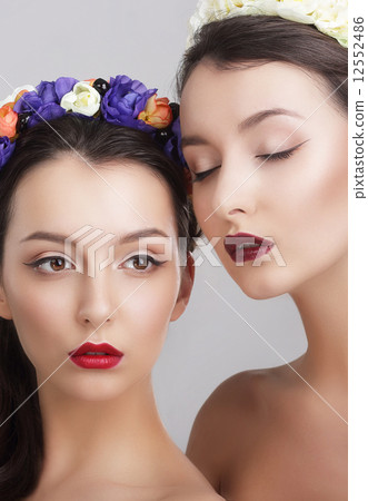 Imagination. Women in Garlands with Vernal Flowers 12552486