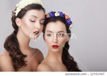 Sentiment. Glamor. Gorgeous Women in Wreaths of Flowers 12552487