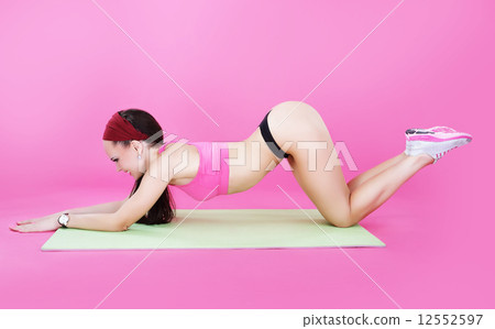 Healthy Lifestyle. Sporty Woman Exercising in Aerobics' Room 12552597