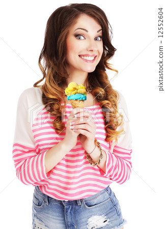 Friendly Woman Holding Ice Cream and Smiling 12552604