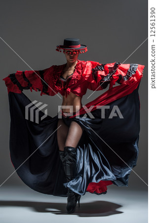 Woman in beautifull red dress dancing in a studio Woman in beautifull red dress dancing in a studio 12561390