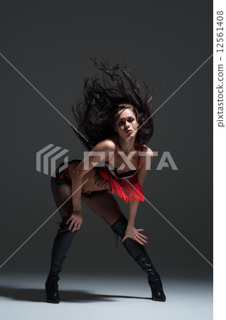 Sexy woman dancing. Photo in a studio Sexy woman dancing. Photo in a studio 12561408