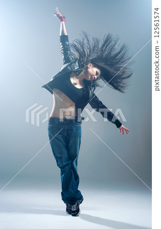 Brunett dancer. Woman dancing in a studio 12561574