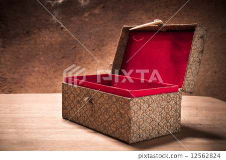Old open vintage box with grunge background, still life. Old open vintage box with grunge background, still life. 12562824