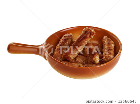 sausages wrapped in bacon in a frying pan, chevapchichi on white background sausages wrapped in bacon in a frying pan, chevapchichi on white background 12566643