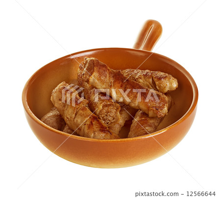 sausages wrapped in bacon in a frying pan, chevapchichi on white background 12566644