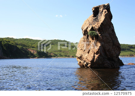 Rocky beach on the bank of island "Putjatin". Russia 12570975