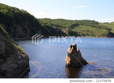 Rocky beach on the bank of island "Putjatin". Russia 12570976