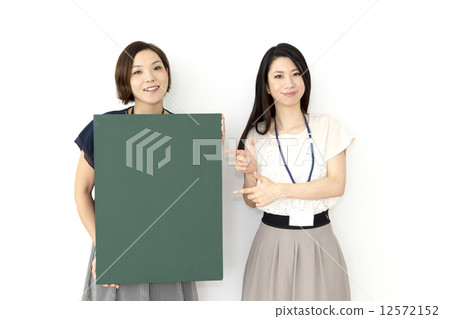 A woman with a message board 12572152