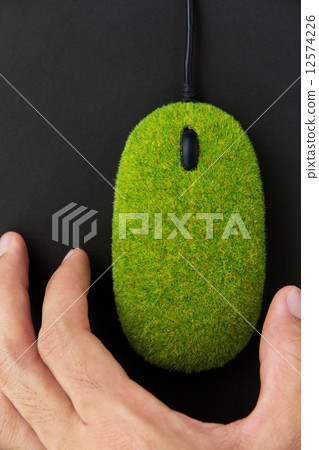 hand holding green computer mouse hand holding green computer mouse 12574226