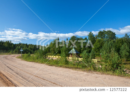 Russia. Small church at a dirt road roadside 12577222