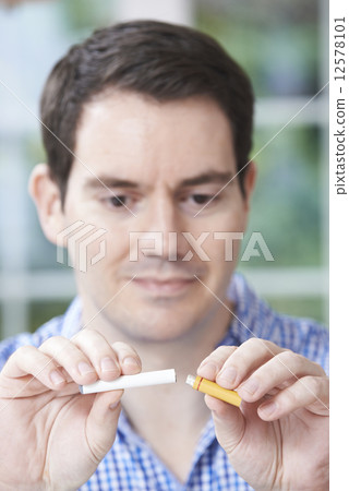 Man Using Electronic Cigarette To Stop Smoking 12578101