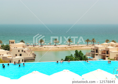 The tourists enjoying their vacation at luxury hotel, Ras Al Khaimah, UAE. The tourists enjoying their vacation at luxury hotel, Ras Al Khaimah, UAE. 12578845