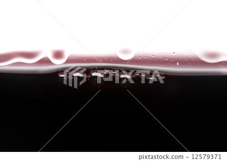 Red wine in a glass closeup 12579371