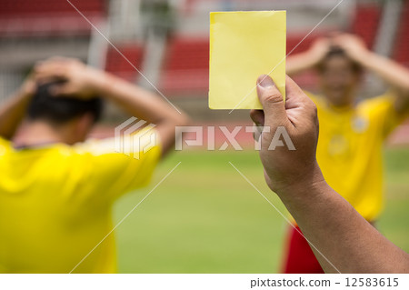 Referee soccer show card for warning and  recorded player foul 12583615