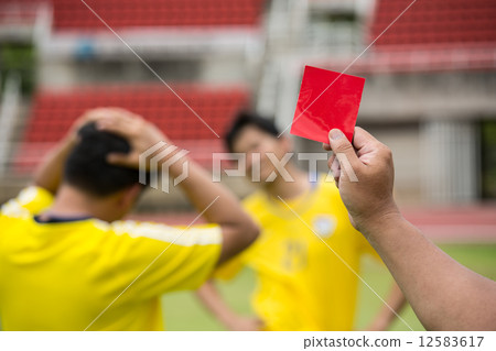 Referee soccer show card for warning and  recorded player foul 12583617