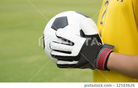 Goalkeeper used hands for catches the ball Goalkeeper used hands for catches the ball 12583626